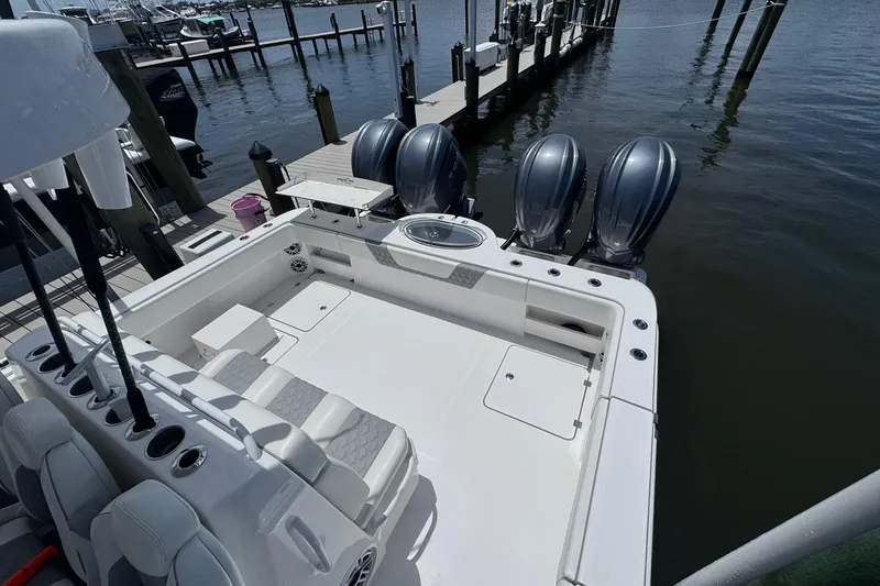 Slide: The Image of 2024 Invincible 35 Catamaran with triple engines docked at marina. - 12