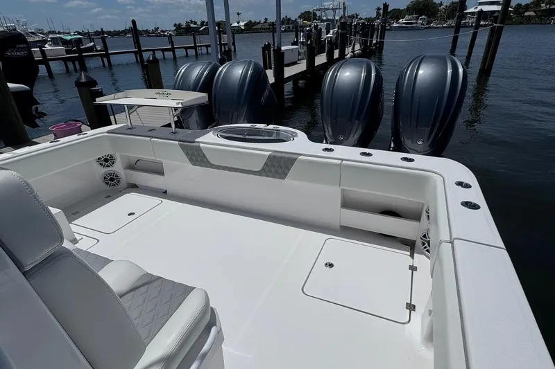 Slide: The Image of 2024 Invincible 35 Catamaran with triple engines docked at marina. - 14