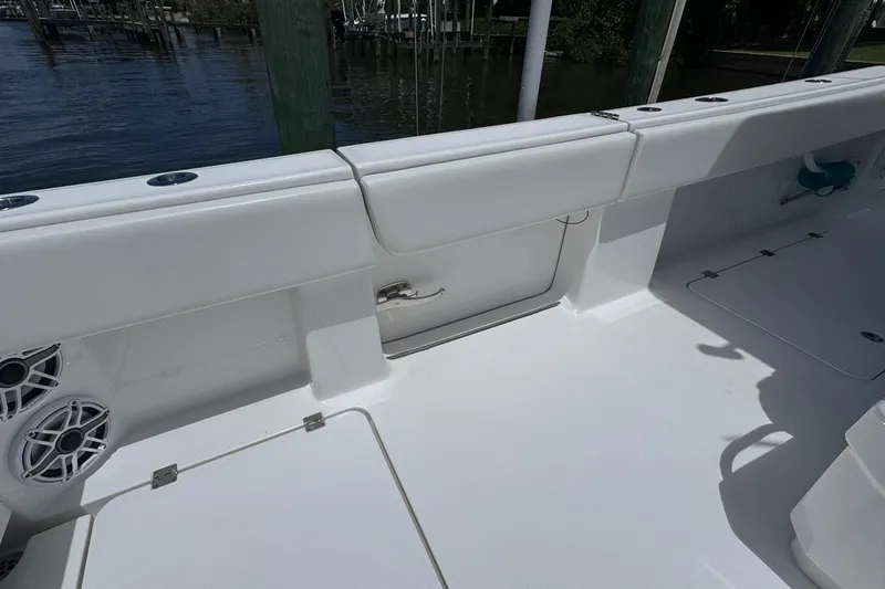 Slide: The Image of 2024 Invincible 35 Catamaran deck with storage compartments and speakers. - 22