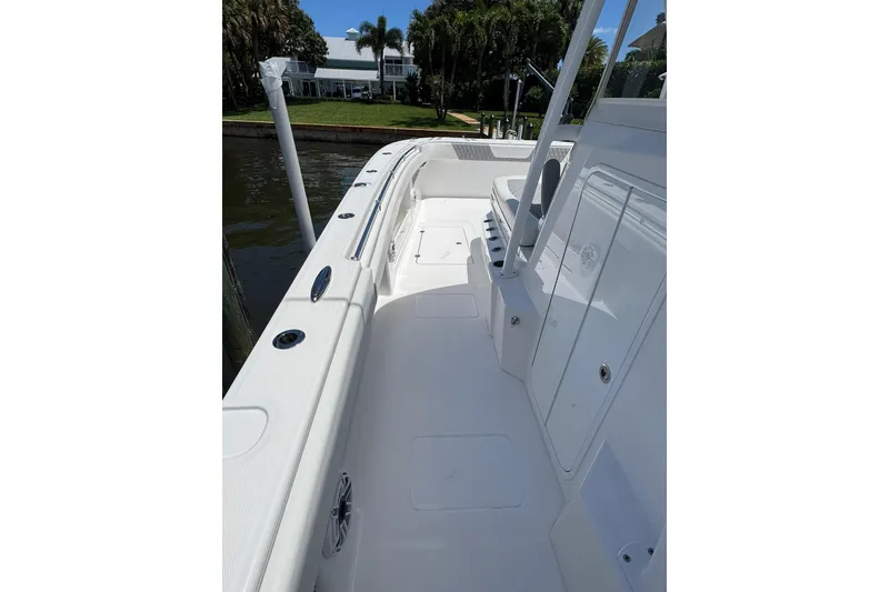 Slide: The Image of 2024 Invincible 35 Catamaran deck with sleek white design and spacious layout. - 5