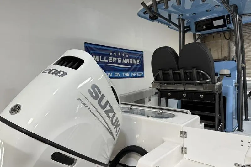 Slide: The Image of 2026 Sea Pro 222 Center Console with Suzuki 200 outboard motor in showroom. - 10