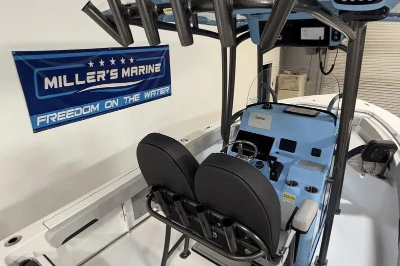 Slide: The Image of 2026 Sea Pro 222 Center Console boat interior at Miller's Marine showroom. - 12