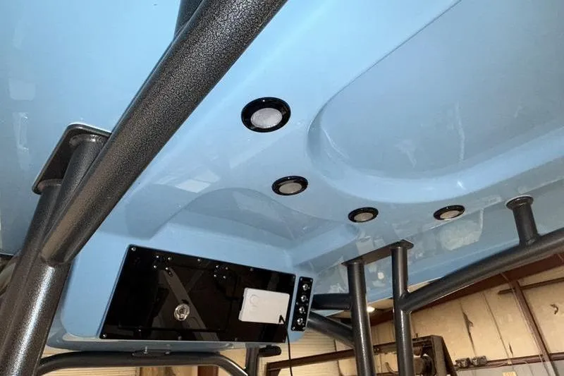 Slide: The Image of 2026 Sea Pro 222 Center Console boat interior with blue ceiling and built-in lights. - 13