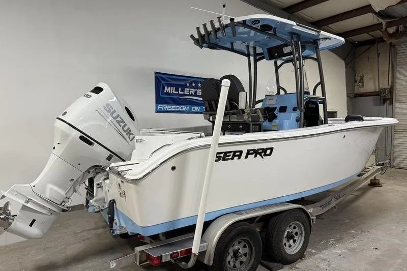 Slide: The Image of 2026 Sea Pro 222 Center Console boat on trailer with Suzuki outboard motor. - 2