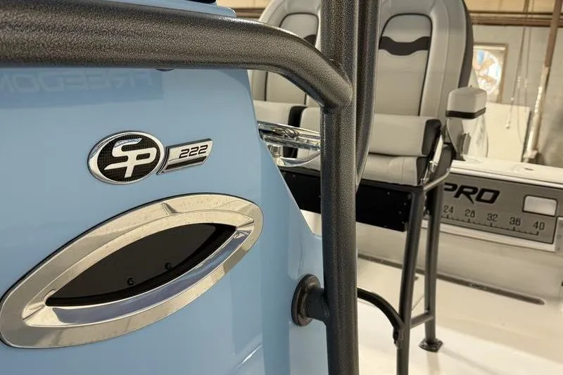 Slide: The Image of 2026 Sea Pro 222 Center Console boat interior with seating and logo detail. - 20