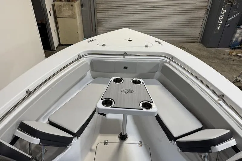 Slide: The Image of 2026 Sea Pro 222 Center Console boat interior with seating and table. - 23