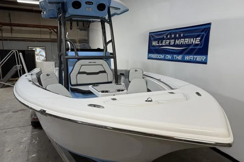 Slide: The Image of 2026 Sea Pro 222 Center Console boat displayed indoors at Miller's Marine showroom. - 3