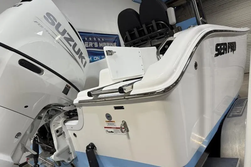 Slide: The Image of 2026 Sea Pro 222 Center Console boat with Suzuki engine in showroom. - 4