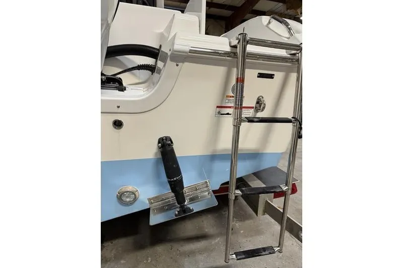 Slide: The Image of 2026 Sea Pro 222 Center Console boat with ladder and trim tab detail. - 6