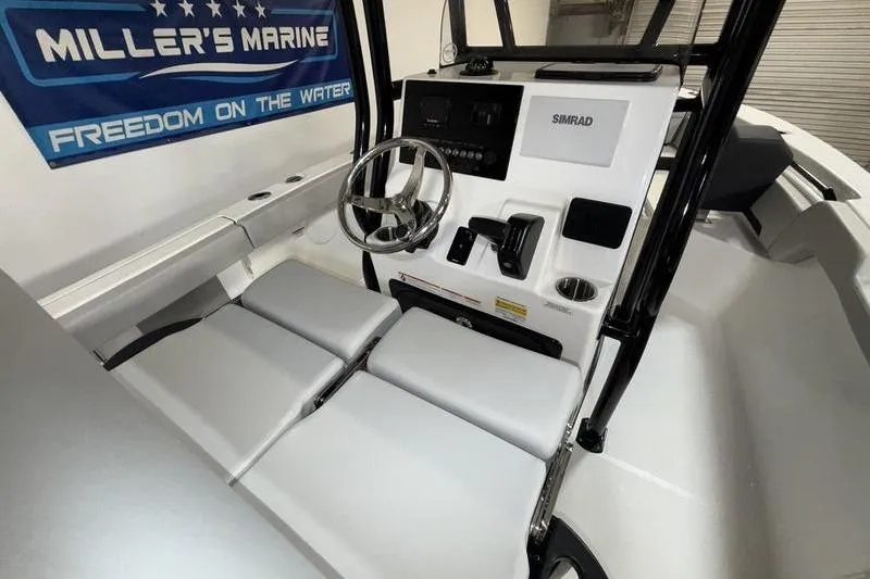 Slide: The Image of Interior view of 2026 Sea Pro 225 FLXR Sandbar boat with steering console. - 10