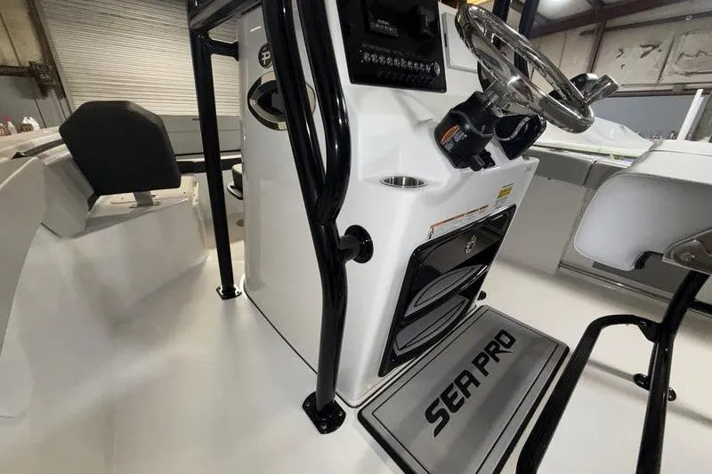 Slide: The Image of Interior view of 2026 Sea Pro 225 FLXR Sandbar boat console and seating. - 11