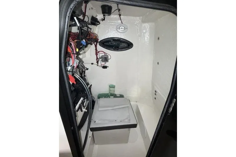 Slide: The Image of Interior view of 2026 Sea Pro 225 FLXR Sandbar boat's storage compartment. - 13