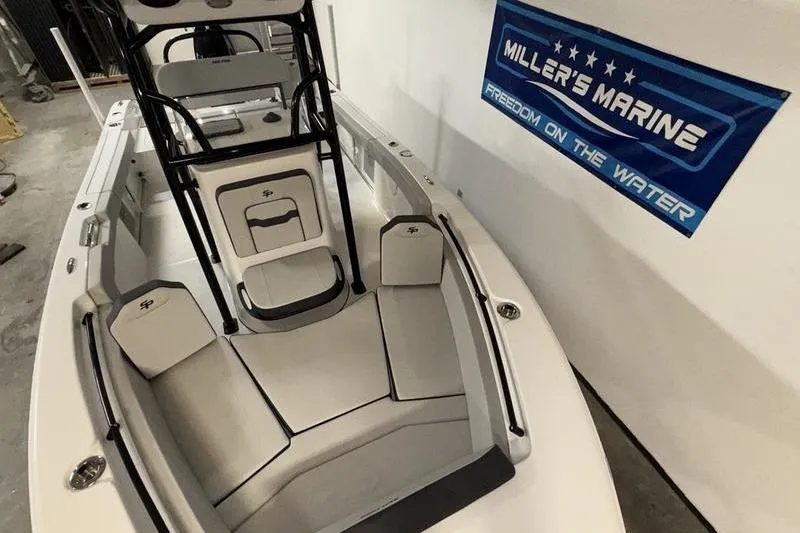 Slide: The Image of 2026 Sea Pro 225 FLXR Sandbar boat interior at Miller's Marine showroom. - 15