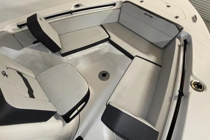 Slide: The Image of 2026 Sea Pro 225 FLXR Sandbar boat interior with cushioned seating. - 17