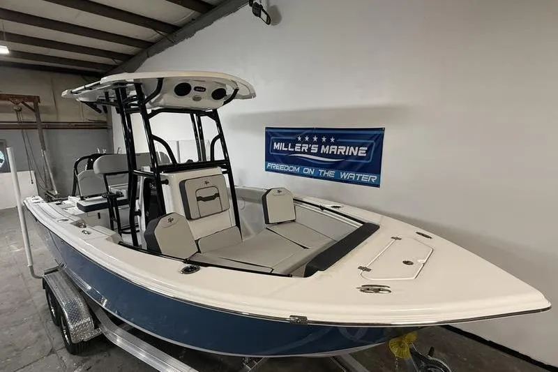 Slide: The Image of 2026 Sea Pro 225 FLXR Sandbar boat displayed indoors at Miller's Marine. - 3