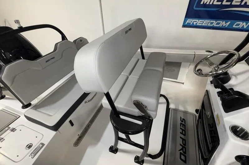 Slide: The Image of 2026 Sea Pro 225 FLXR Sandbar boat interior with seating and steering wheel. - 6