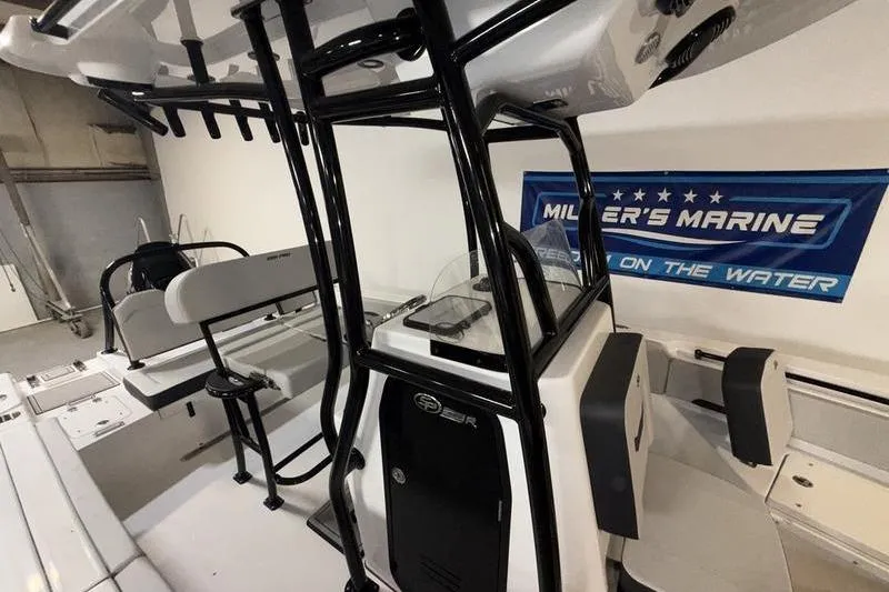 Slide: The Image of 2026 Sea Pro 225 FLXR Sandbar boat interior at Miller's Marine showroom. - 8