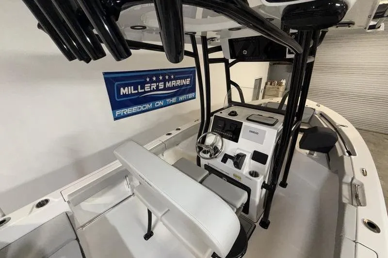 Slide: The Image of Interior view of 2026 Sea Pro 225 FLXR Sandbar boat at Miller's Marine showroom. - 9