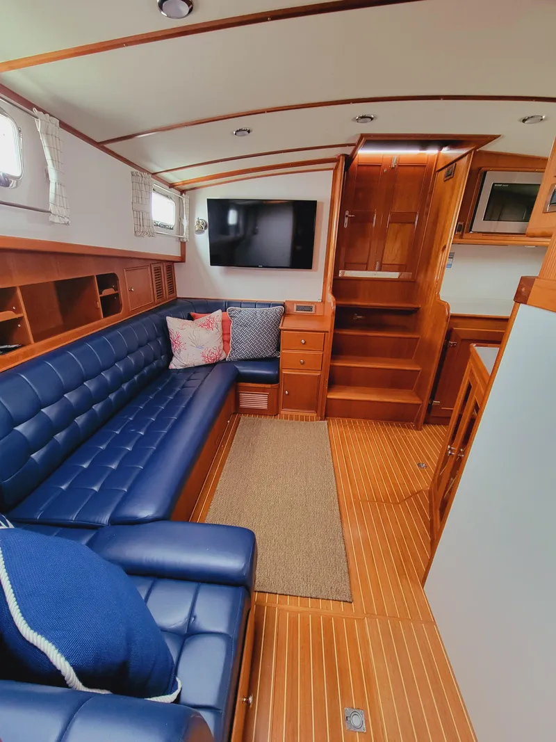 Slide: The Image of Interior of 2004 Grand Banks 49 Eastbay HX with blue leather sofas. - 13