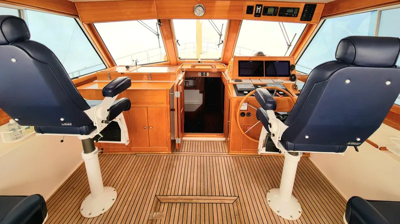 Slide: The Image of Interior of 2004 Grand Banks 49 Eastbay HX with two captain's chairs. - 2