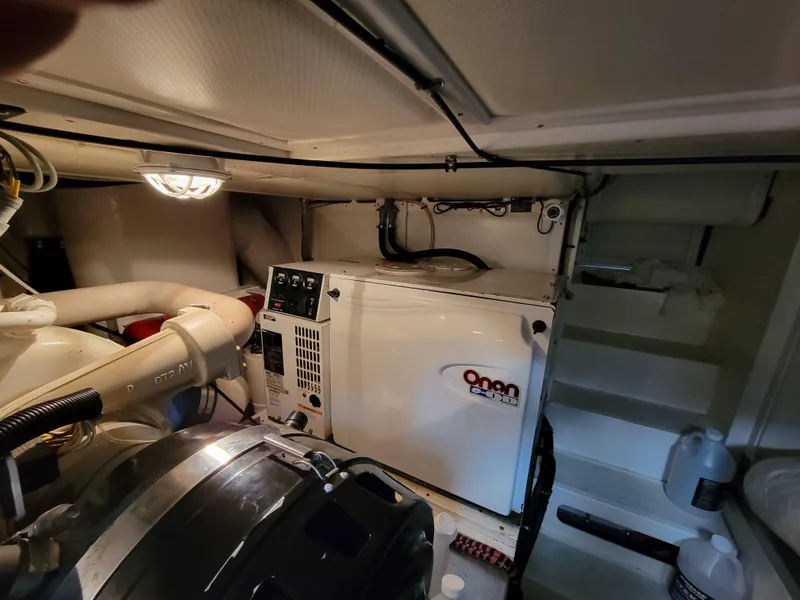 Slide: The Image of Engine room of 2004 Grand Banks 49 Eastbay HX with Onan generator. - 27