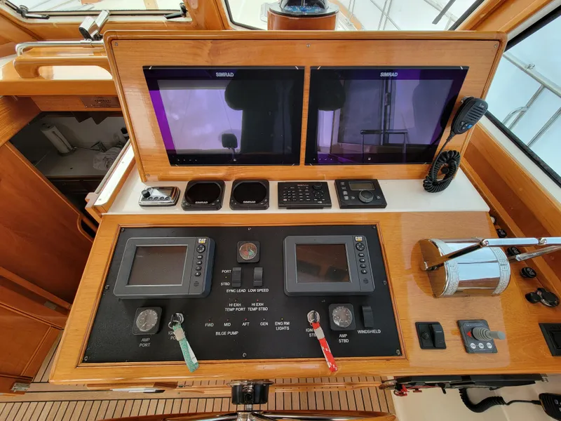 Slide: The Image of 2004 Grand Banks 49 Eastbay HX helm with navigation screens. - 6
