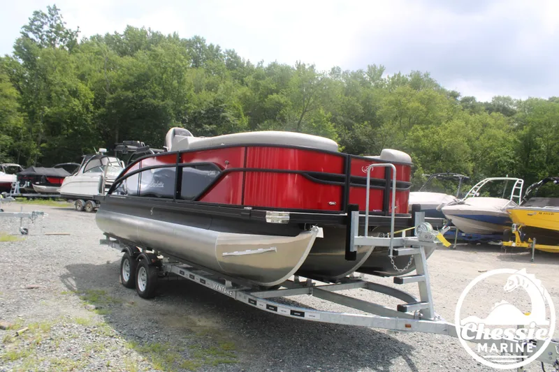 Slide: The Image of 2025 Barletta Cabrio C20UC pontoon boat on trailer outdoors. - 3