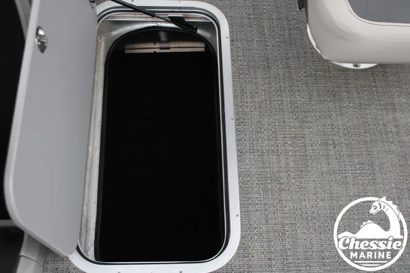 Slide: The Image of Barletta Cabrio C24UC 2025 boat hatch with carpeted interior. - 14