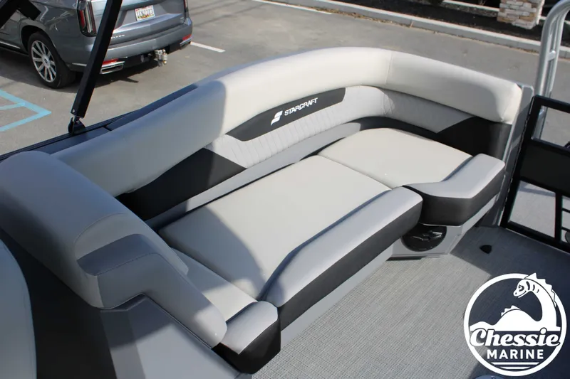 Slide: The Image of Starcraft VX 22 R DH 2026 boat with gray upholstered seating. - 16
