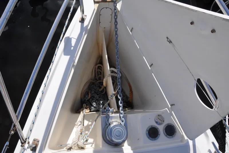 Slide: The Image of Anchor locker of 2003 Catalina 387 sailboat with chain and rope storage. - 12