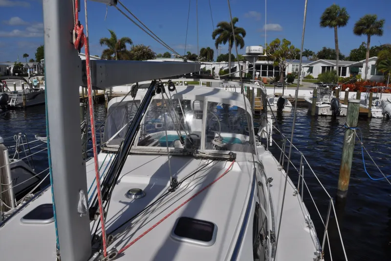 Slide: The Image of Catalina 387 sailboat docked at marina, sunny day, palm trees in background, 2003 model. - 14