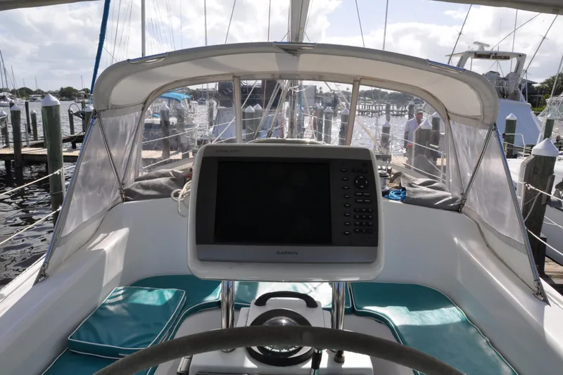 Slide: The Image of Cockpit view of 2003 Catalina 387 sailboat with navigation equipment at marina. - 23