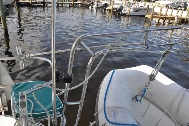 Slide: The Image of Catalina 387 sailboat stern with dinghy, docked at marina, 2003 model. - 24