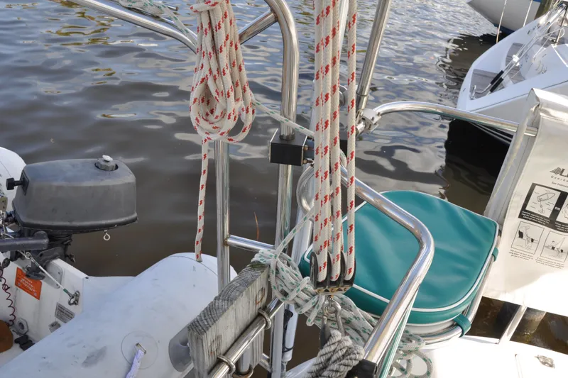Slide: The Image of Catalina 387 sailboat, 2003 model, featuring ropes and motor at dockside. - 28