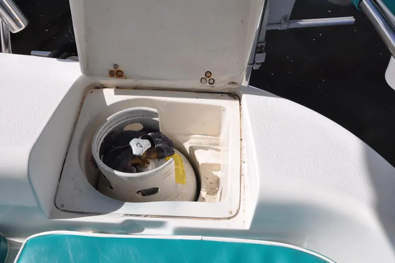 Slide: The Image of Open storage compartment on 2003 Catalina 387 boat with propane tank inside. - 30