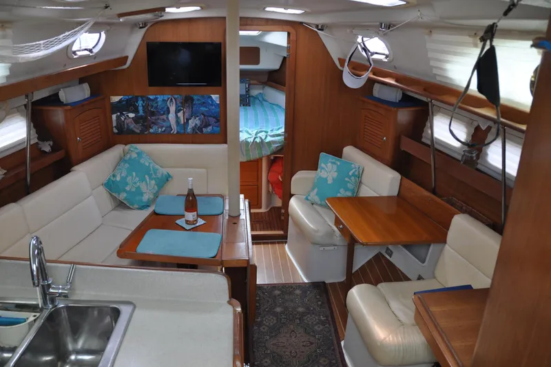 Slide: The Image of Interior of a 2003 Catalina 387 yacht with cozy seating area. - 31