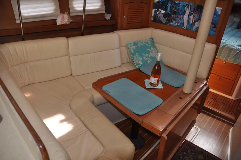 Slide: The Image of Luxurious interior of 2003 Catalina 387 yacht with cozy seating and dining area. - 33