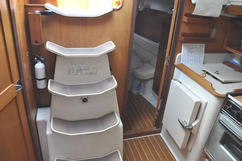 Slide: The Image of Interior of a 2003 Catalina 387 yacht with stairs and kitchen. - 36