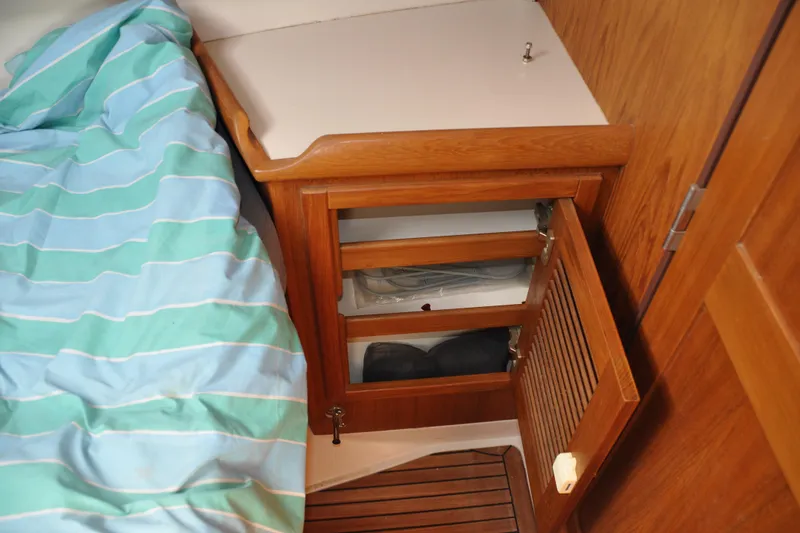 Slide: The Image of Wooden cabinet and bed in 2003 Catalina 387 yacht interior. - 44
