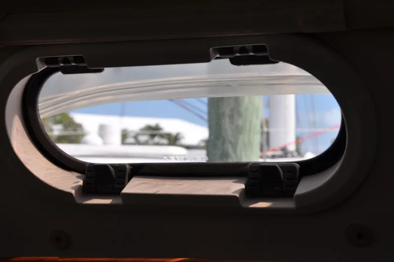 Slide: The Image of View through a Catalina 387 boat window, showcasing mast and sky, 2003 model. - 46