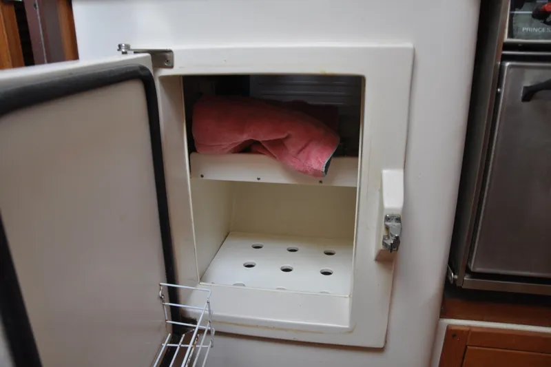 Slide: The Image of Open storage compartment in a 2003 Catalina 387 boat interior. - 55