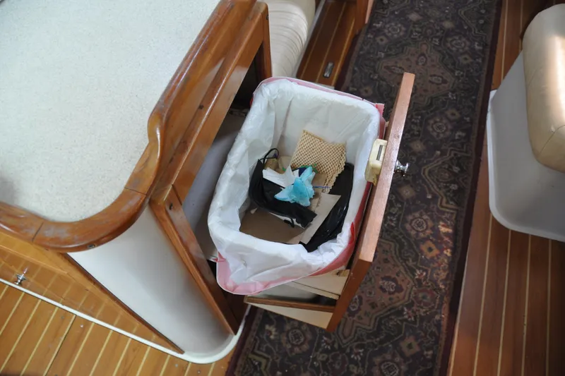 Slide: The Image of Pull-out trash bin in 2003 Catalina 387 yacht interior. - 60