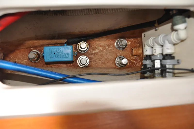 Slide: The Image of Electrical and plumbing components inside a 2003 Catalina 387 boat. - 61