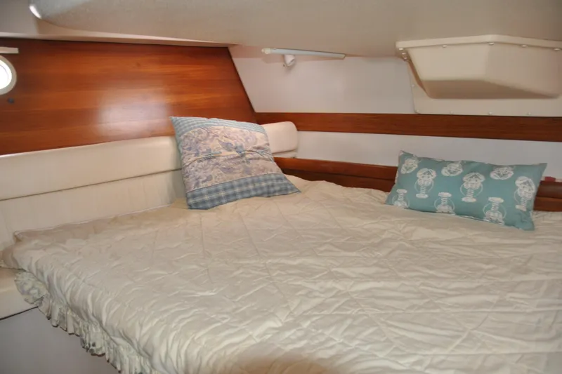 Slide: The Image of Cozy cabin interior of 2003 Catalina 387 sailboat with comfortable bedding. - 70