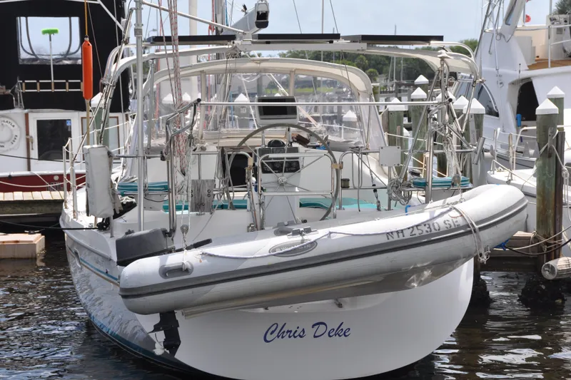 Slide: The Image of Catalina 387 sailboat from 2003 docked with inflatable dinghy attached. - 82