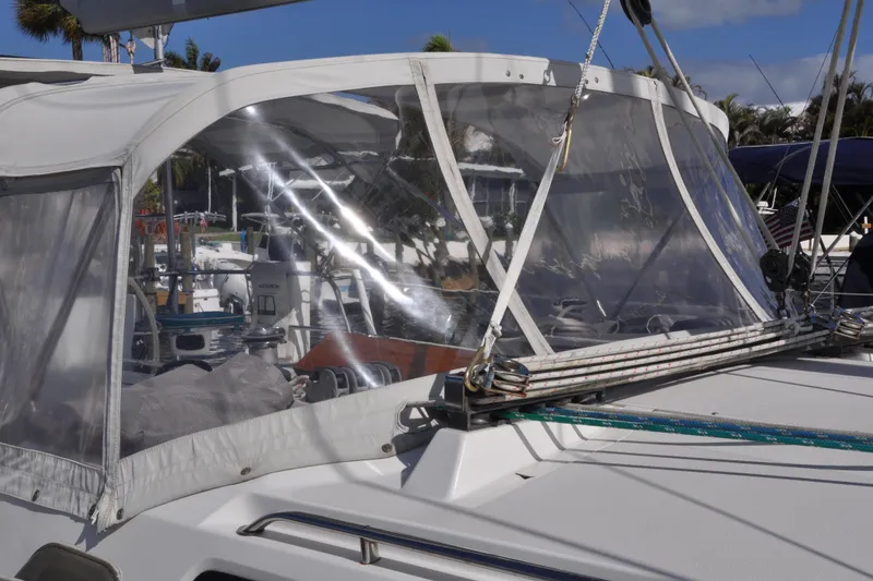 Slide: The Image of 2003 Catalina 387 sailboat with clear cockpit enclosure and visible rigging. - 9