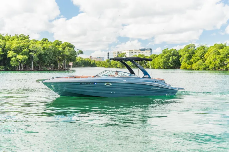 The Image of 2017 Cruisers Sport Series 298 Bow Rider South Beach Edition on scenic waterway. - 0