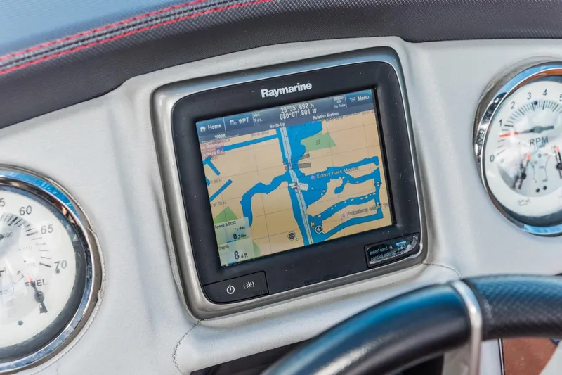 Slide: The Image of Raymarine navigation system on 2017 Cruisers Sport Series 298 Bow Rider dashboard. - 10