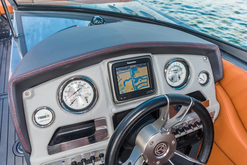 Slide: The Image of Dashboard of 2017 Cruisers Sport Series 298 Bow Rider South Beach Edition with navigation display. - 11