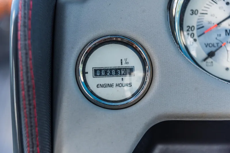 Slide: The Image of Close-up of engine hours gauge on 2017 Cruisers Sport Series 298 Bow Rider. - 12